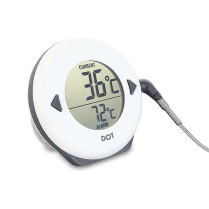 Le Thermomètre DOT pour four de Thermomètre.fr dispose d'un affichage numérique indiquant une température actuelle de 36°C et une température d'alarme réglée à 72°C. Avec son afficheur rond et sa sonde connectée, il assure une cuisson facile tandis que l'alarme sonore vous alerte.
